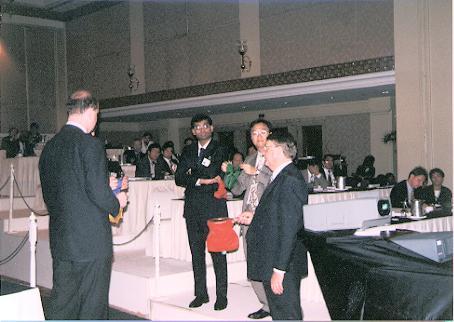 Meeting attendees involved in Marlene's magic act